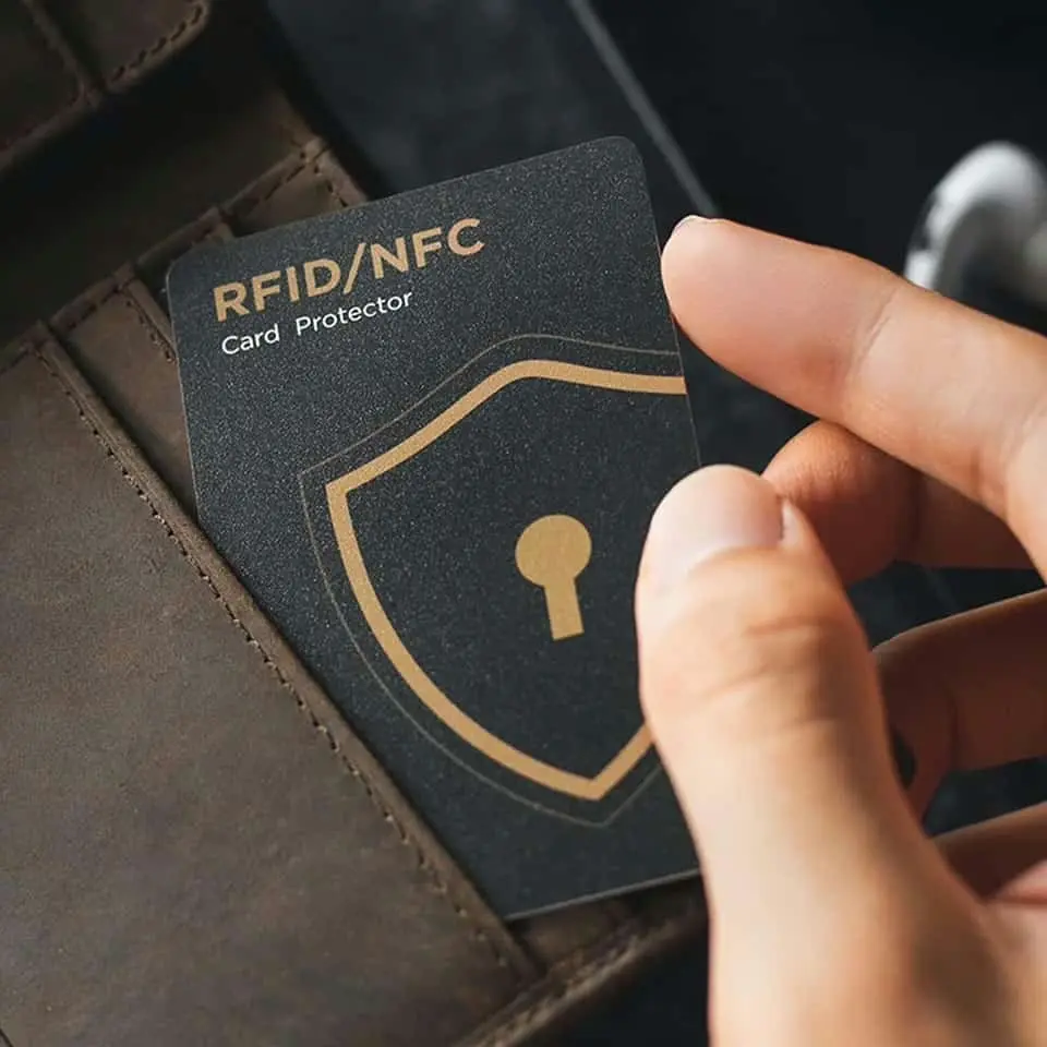 Credifence RFID blocking card placed inside a wallet protecting credit cards from electronic pickpocketing.
